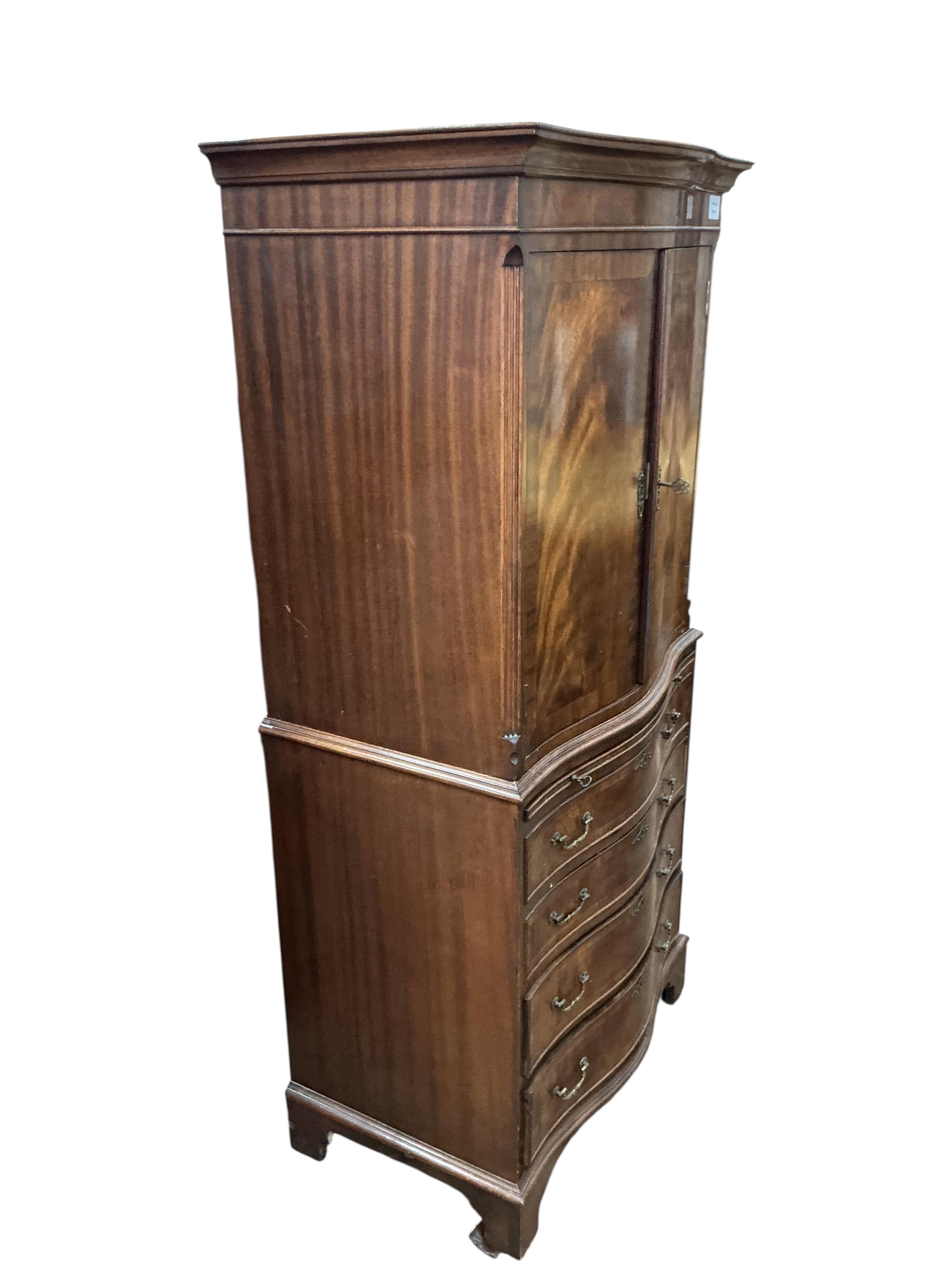 A reproduction George III style serpentine mahogany cocktail cabinet, width 71cm, depth 48cm, height 153cm
